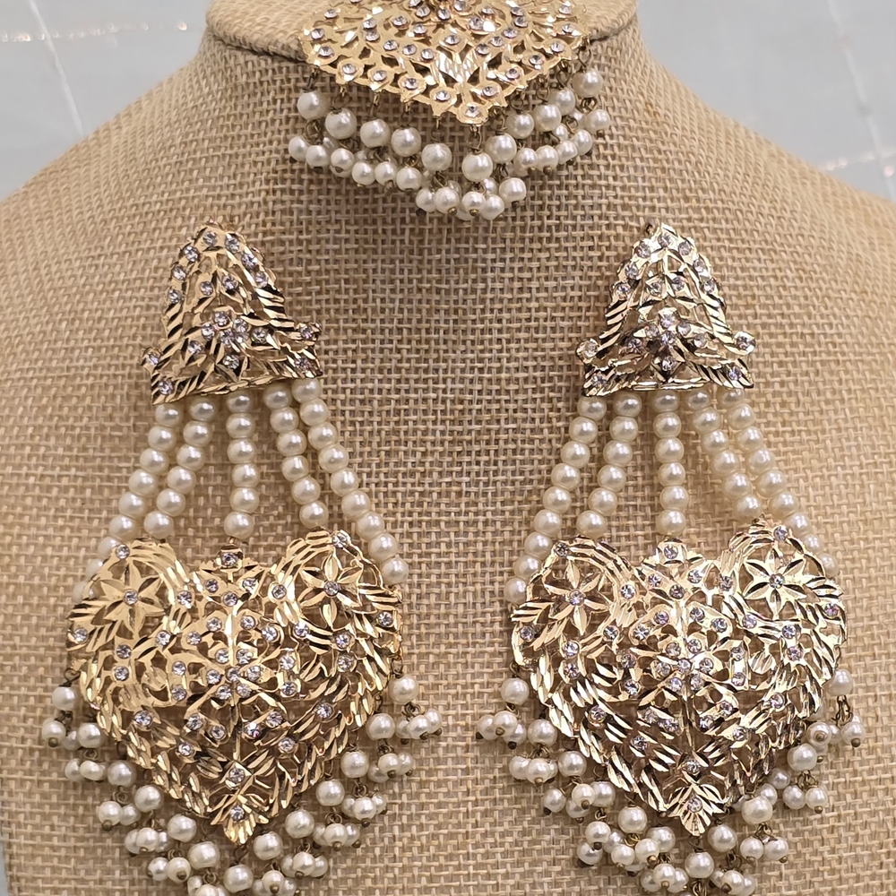 Gold and White Chandelier Earrings with Intricate Design